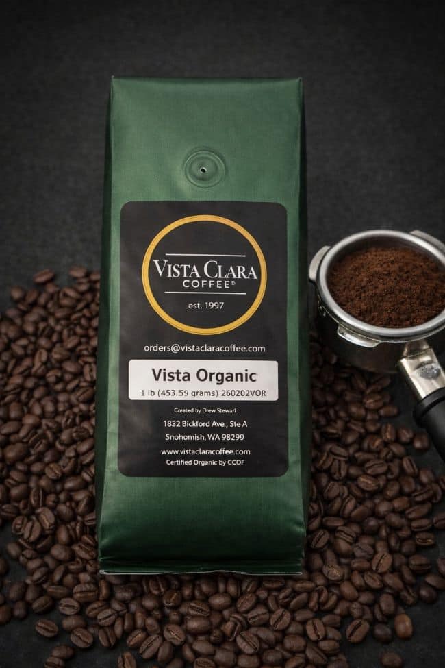 Vista Clara Coffee package with coffee beans and a scoop on a dark background